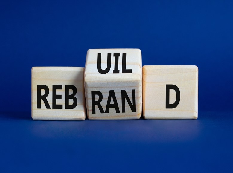 Blocks spelling out “rebrand” and “rebuild.”